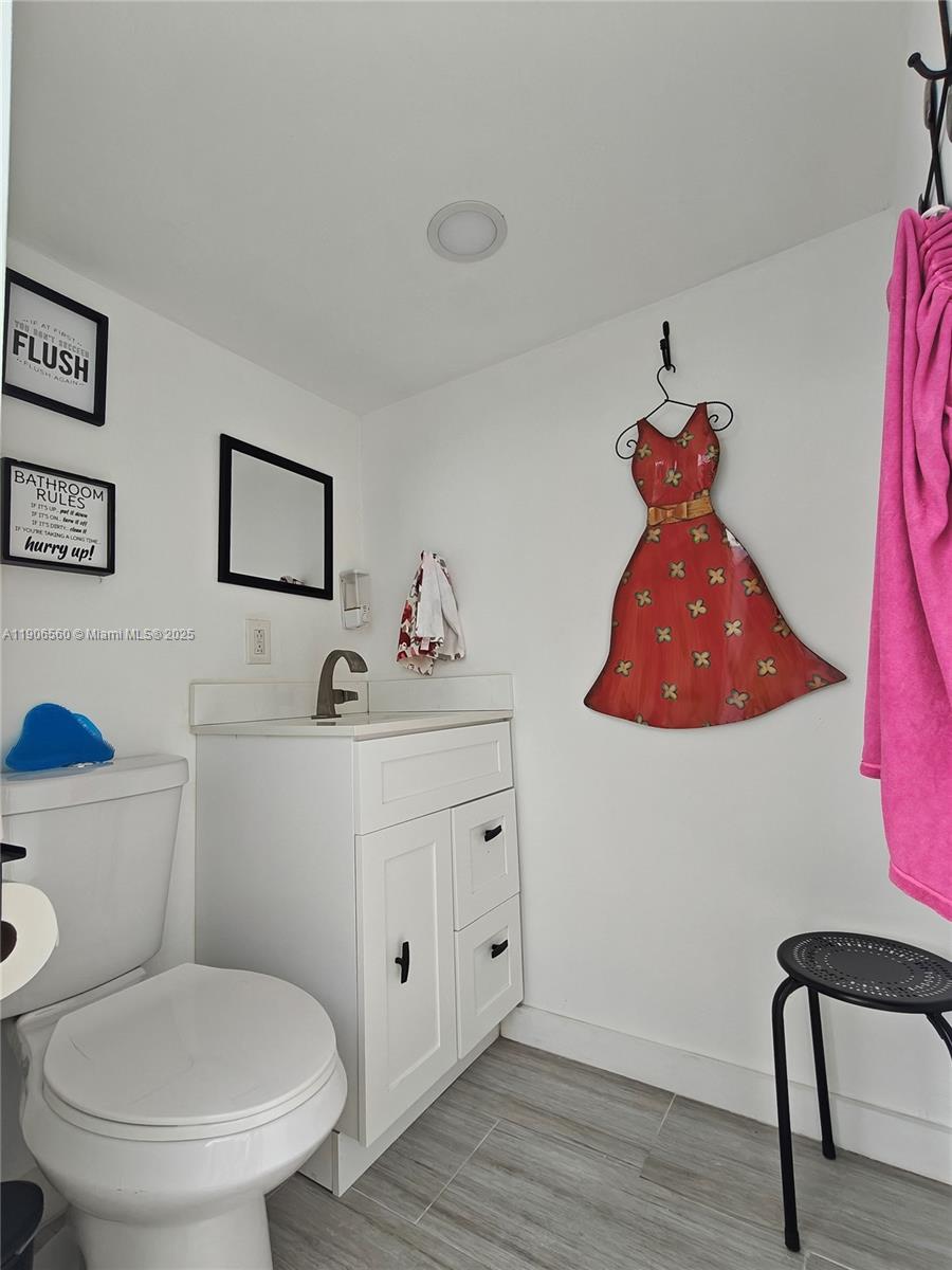14444 Southwest 107th Terrace Miami, FL 33186 - Photo 27 of 73 a bathroom with a toilet sink and mirror