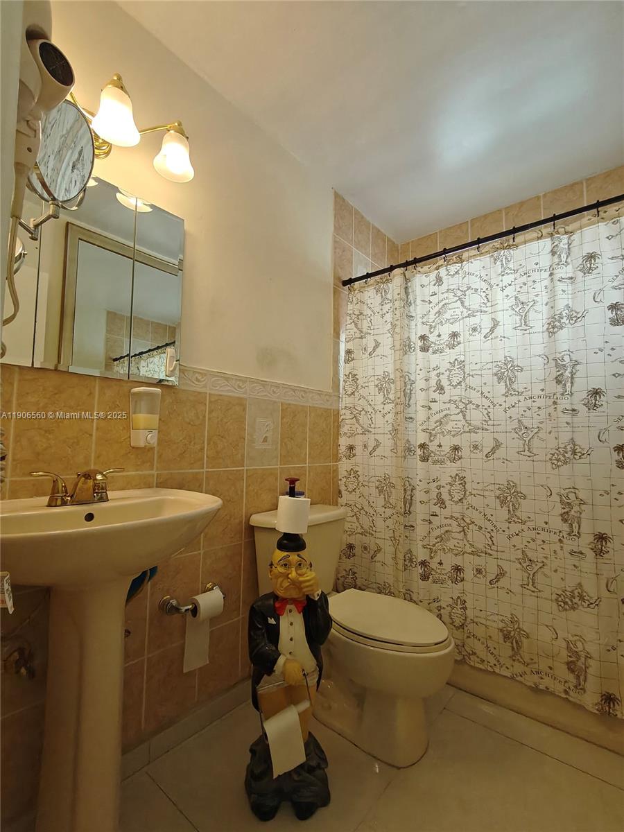 14444 Southwest 107th Terrace Miami, FL 33186 - Photo 29 of 73 a bathroom with a sink toilet and shower