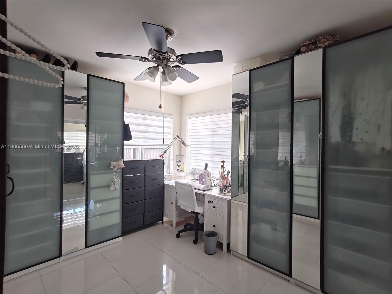 14444 Southwest 107th Terrace Miami, FL 33186 - Photo 34 of 73 a kitchen with a refrigerator a sink and cabinets
