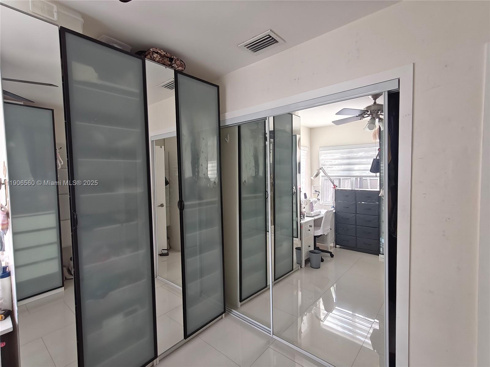 14444 Southwest 107th Terrace Miami, FL 33186 - Photo 35 of 73 a bathroom with a glass shower door