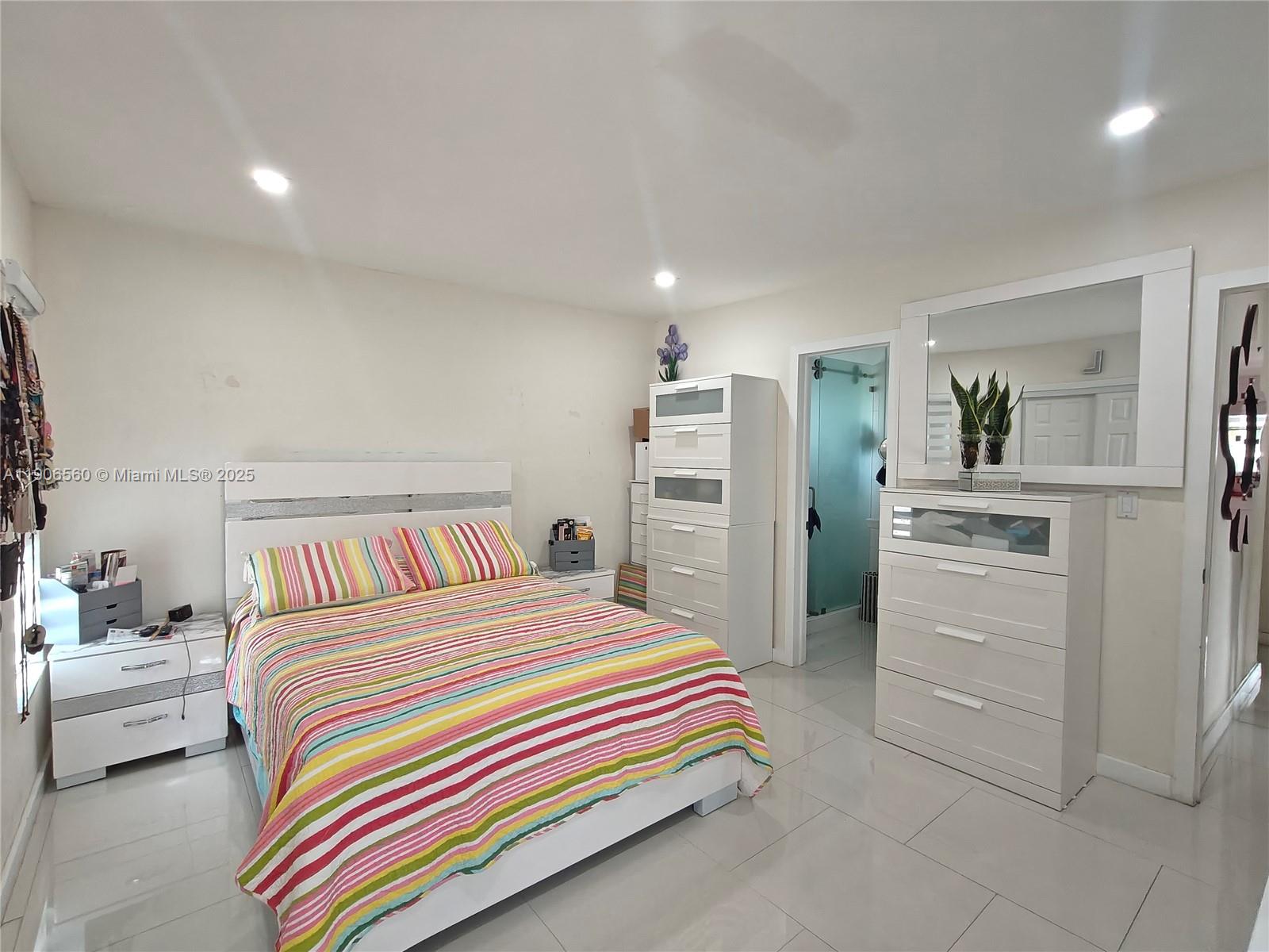 14444 Southwest 107th Terrace Miami, FL 33186 - Photo 39 of 73 a bedroom with a bed and a cabinets