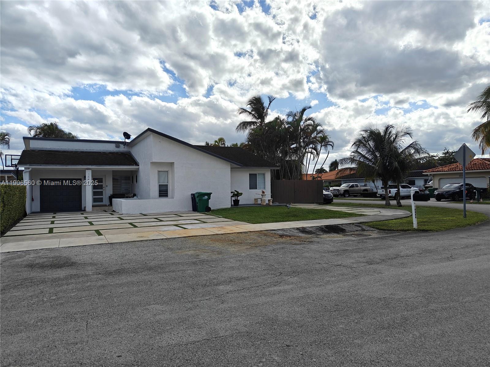 14444 Southwest 107th Terrace Miami, FL 33186 - Photo 4 of 73 a view of a house with a backyard and a tree