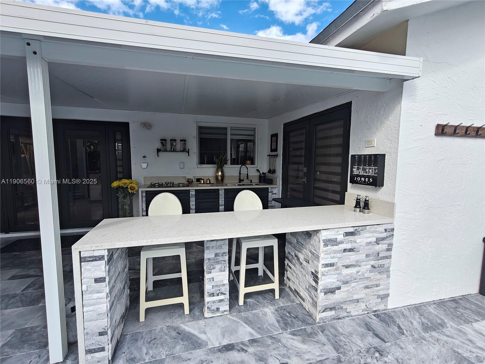 14444 Southwest 107th Terrace Miami, FL 33186 - Photo 46 of 73 a large kitchen with stainless steel appliances a stove and cabinets