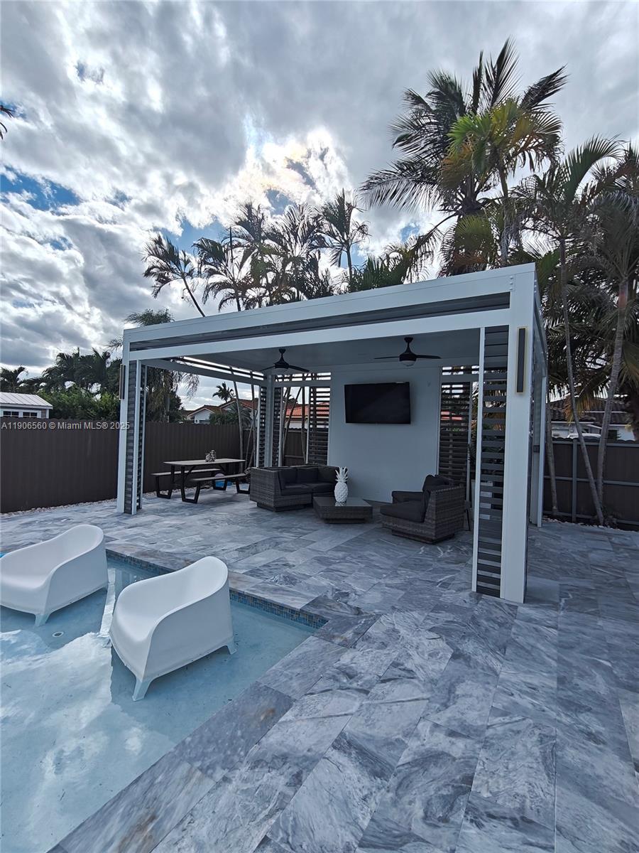 14444 Southwest 107th Terrace Miami, FL 33186 - Photo 50 of 73 a view of living room filled with furniture and a potted plant