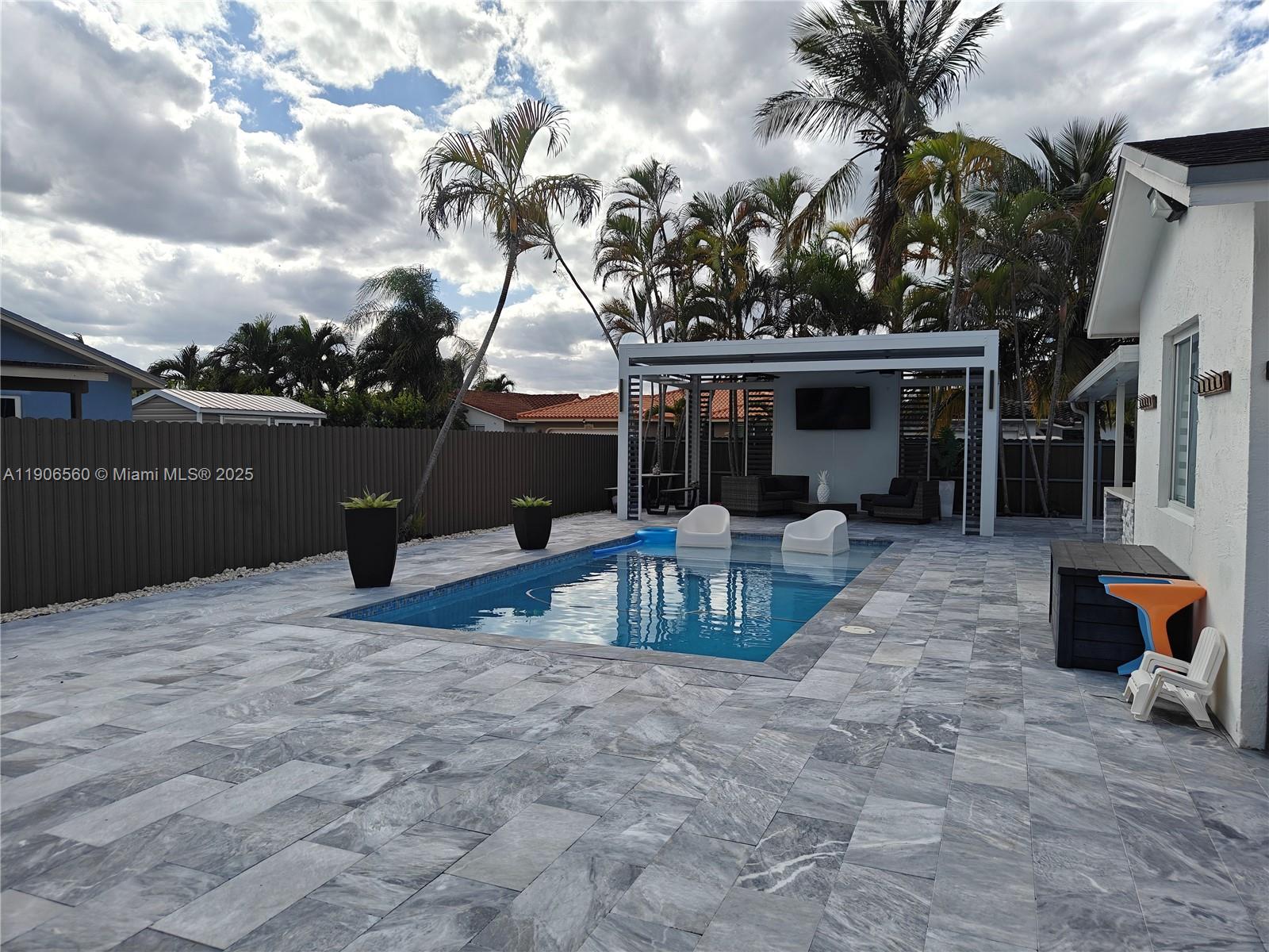 14444 Southwest 107th Terrace Miami, FL 33186 - Photo 51 of 73 a view of a house with backyard and a sitting area