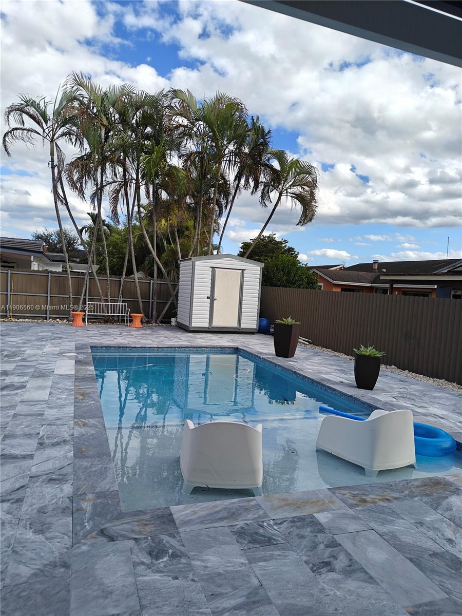 14444 Southwest 107th Terrace Miami, FL 33186 - Photo 54 of 73 a view of a terrace with sitting area