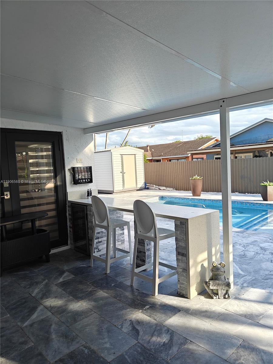 14444 Southwest 107th Terrace Miami, FL 33186 - Photo 67 of 73 a room with chairs a table and chairs