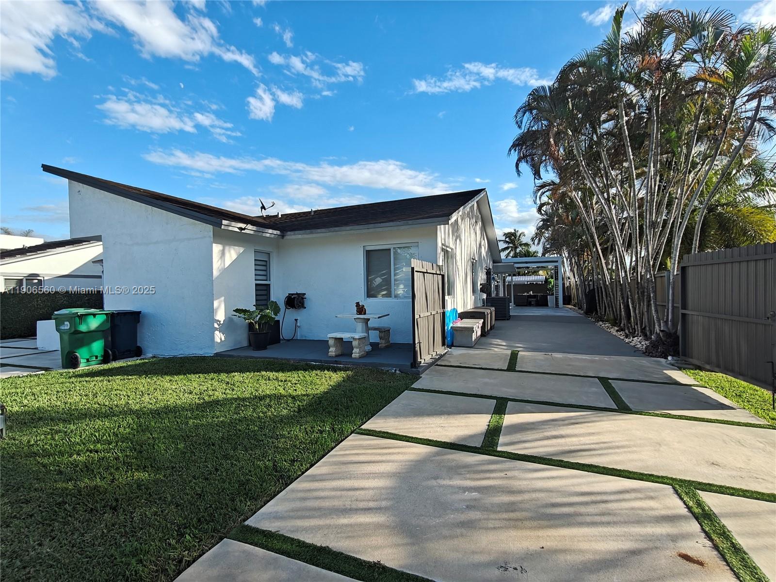 14444 Southwest 107th Terrace Miami, FL 33186 - Photo 70 of 73 a view of a backyard with plants and a patio