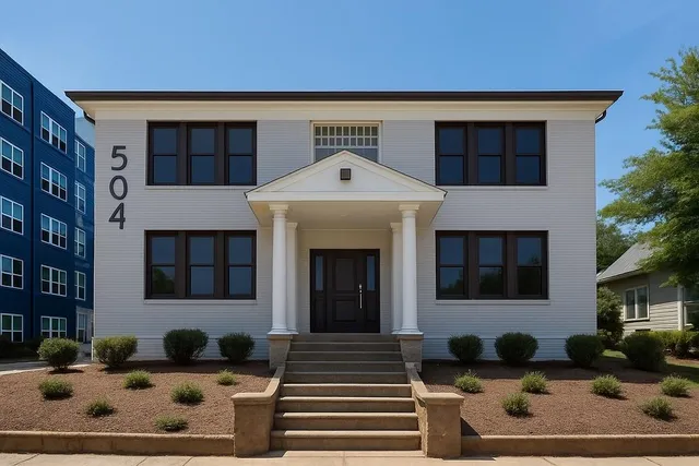a front view of a building with that has a large window