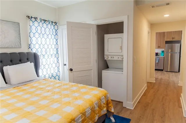 a bedroom with a bed and a chair