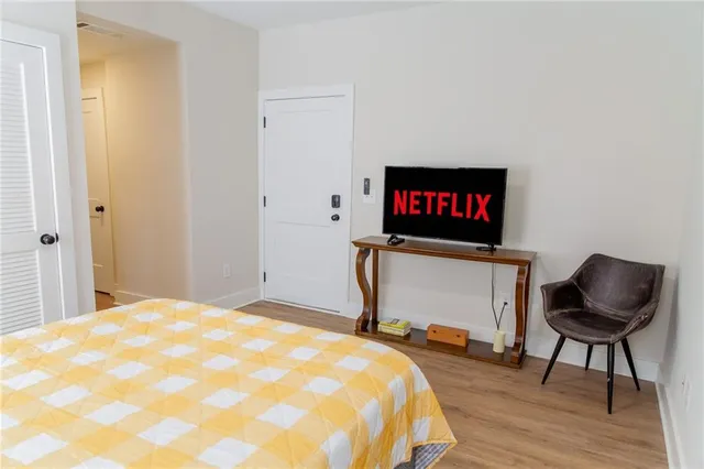 a bedroom with a bed and a table in it