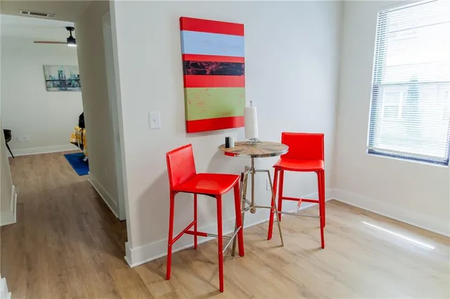 a room that has a table and chairs