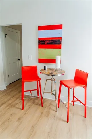 a bed sitting in a bedroom next to a lamp