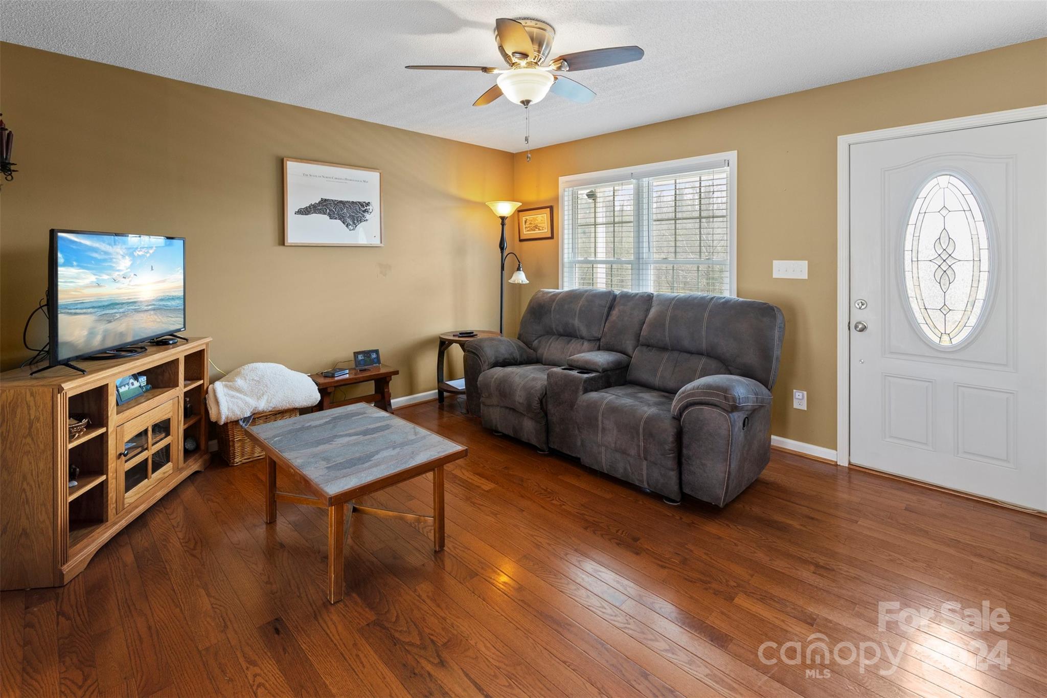 3624 Deerbrook Road Lenoir, NC 28645 - Photo 11 of 28 a living room with furniture and a flat screen tv
