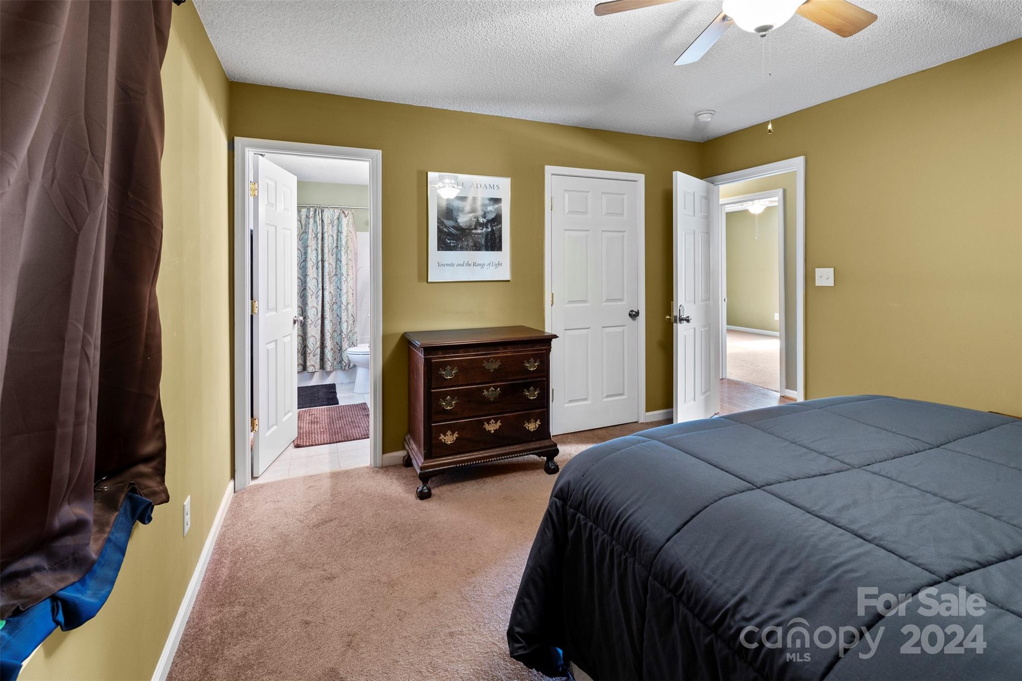 3624 Deerbrook Road Lenoir, NC 28645 - Photo 21 of 28 a bedroom with a bed and a television