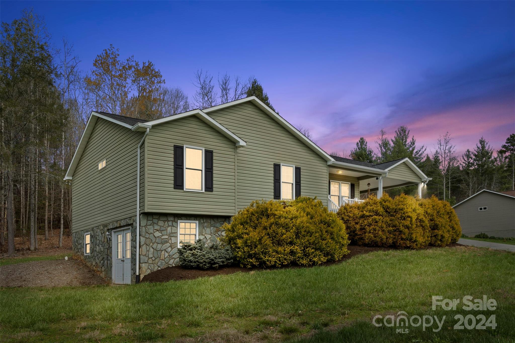 3624 Deerbrook Road Lenoir, NC 28645 - Photo 28 of 28 a front view of a house with a garden
