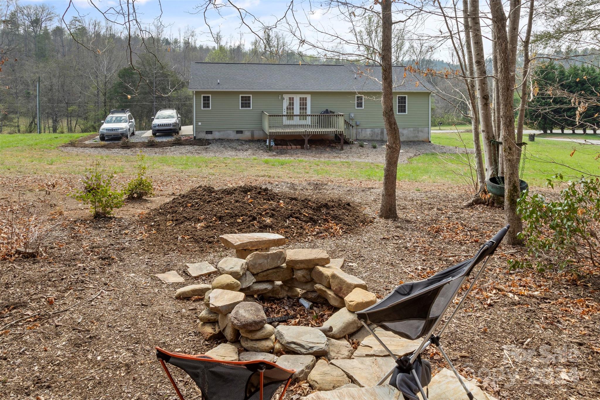 3624 Deerbrook Road Lenoir, NC 28645 - Photo 5 of 28 a view of a house with backyard and sitting area