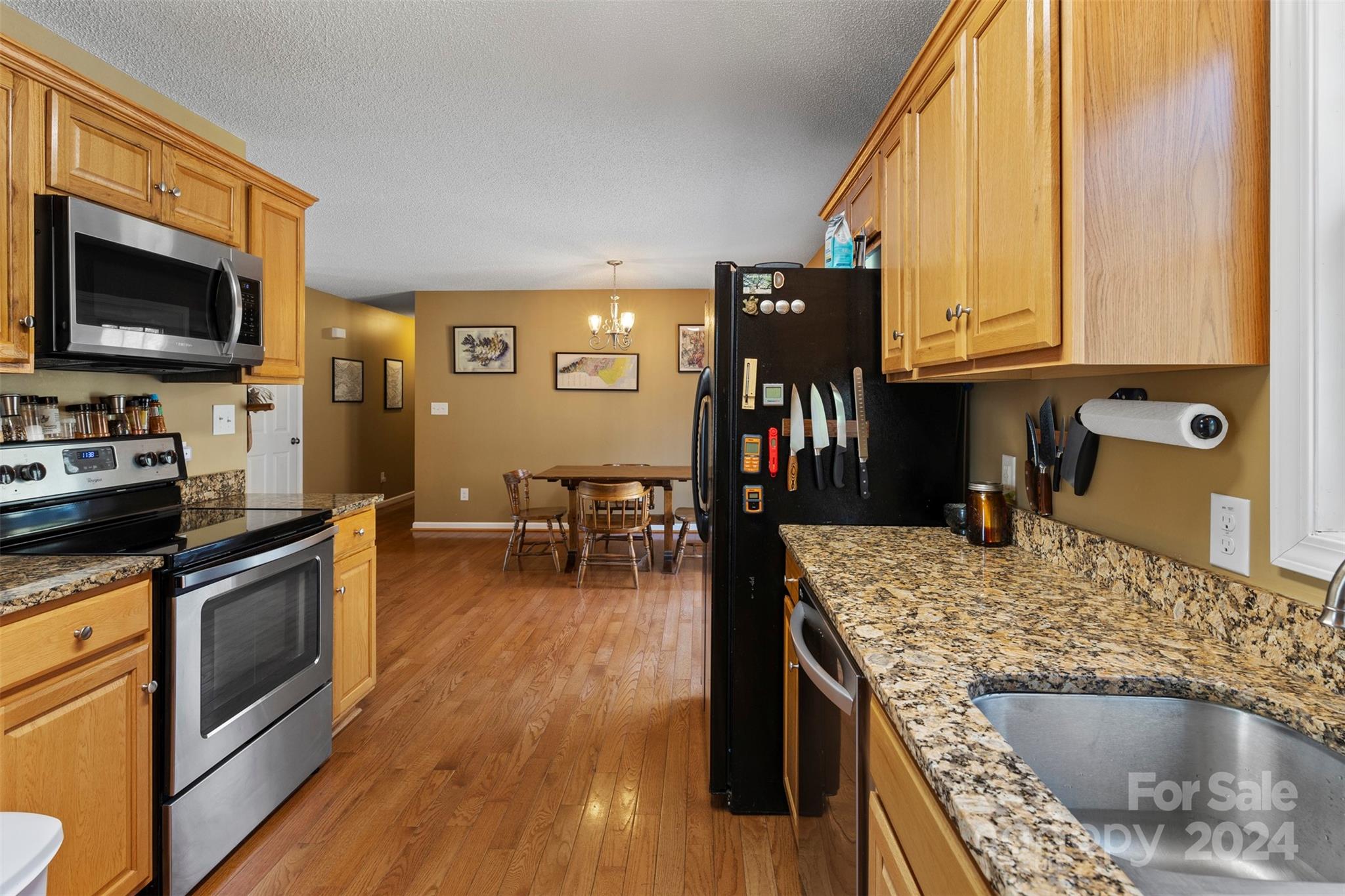 3624 Deerbrook Road Lenoir, NC 28645 - Photo 7 of 28 a kitchen with sink refrigerator and cabinets