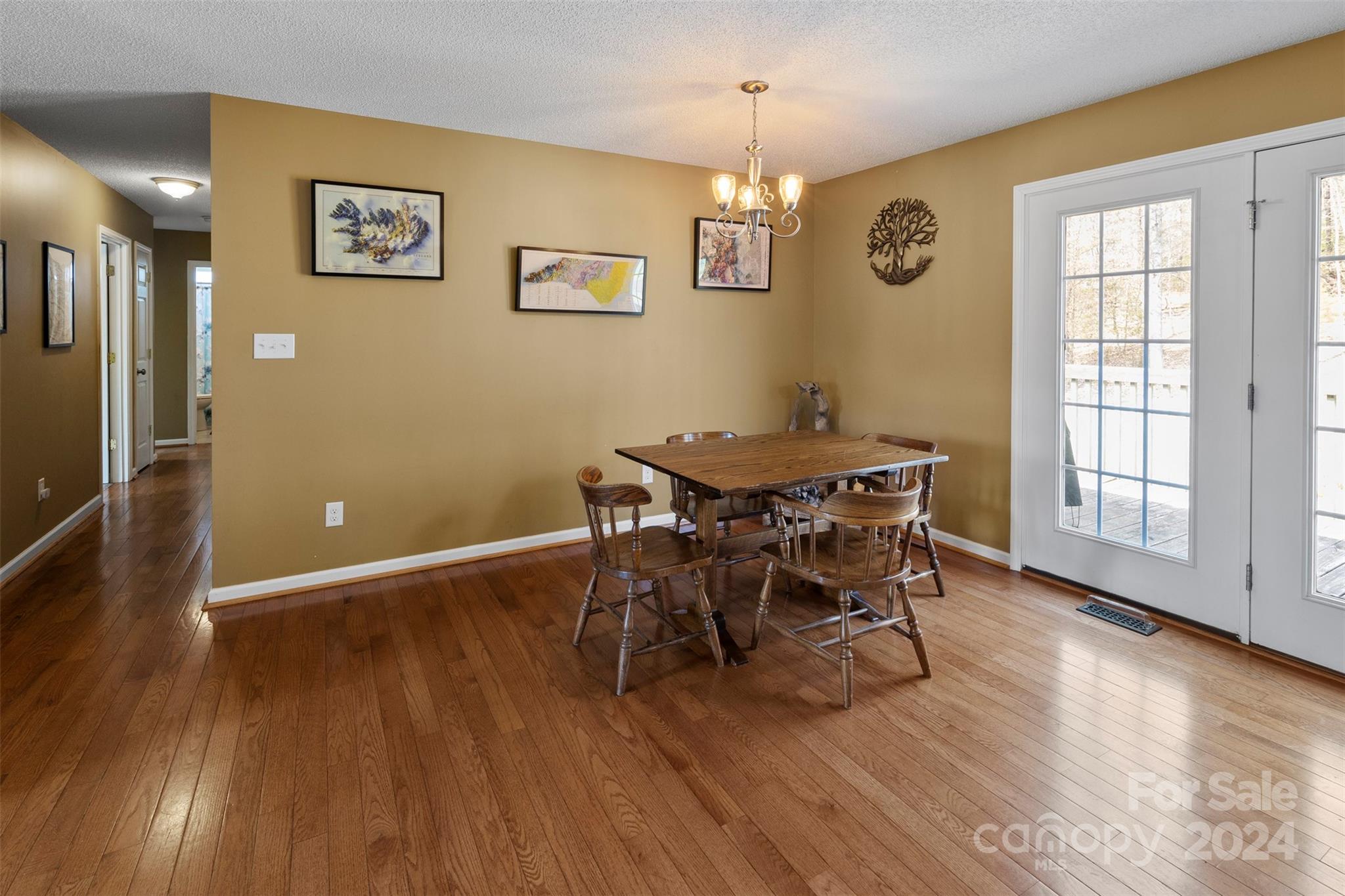 3624 Deerbrook Road Lenoir, NC 28645 - Photo 9 of 28 a view of a dining room with furniture and wooden floor