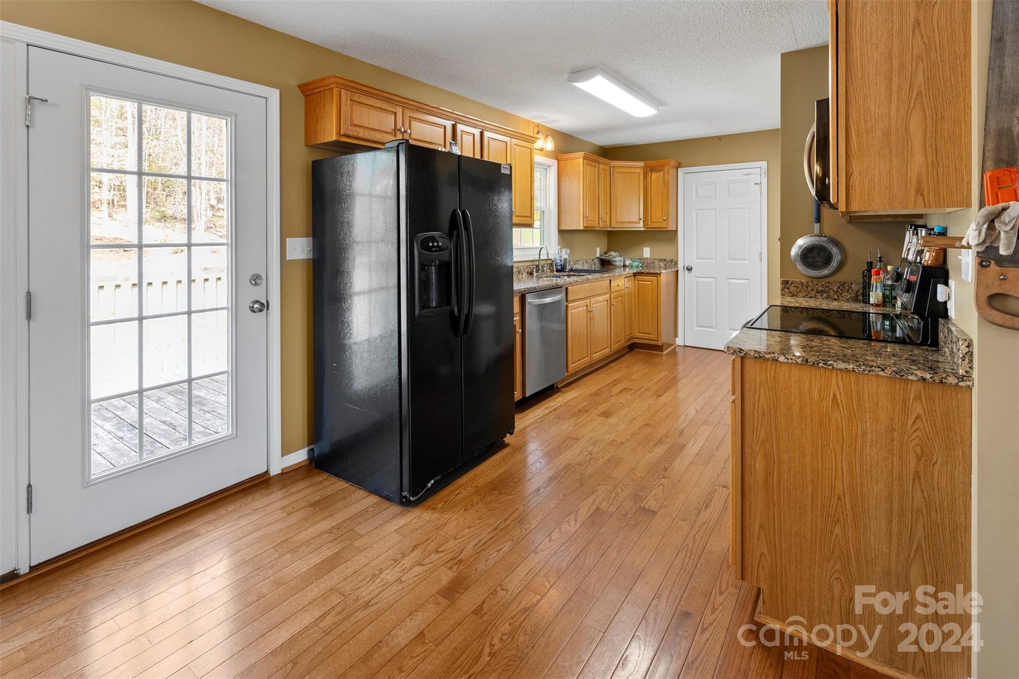3624 Deerbrook Road Lenoir, NC 28645 - Photo 10 of 28 a kitchen with stainless steel appliances a refrigerator and wooden cabinets