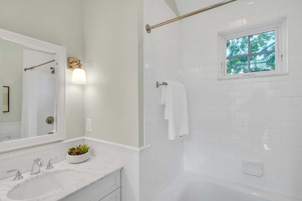 2 Percy Place Cambridge, MA 02139 - Photo 25 of 37 a bathroom with a sink and a mirror