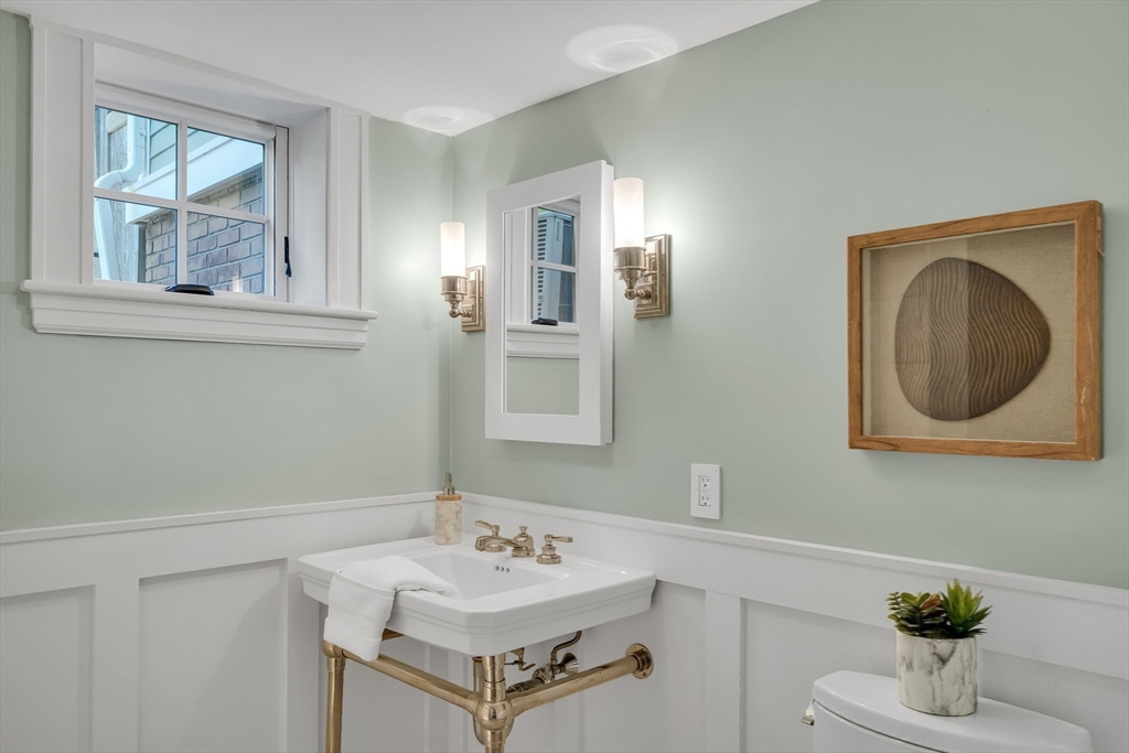 2 Percy Place Cambridge, MA 02139 - Photo 28 of 37 a bathroom with a sink mirror and vanity