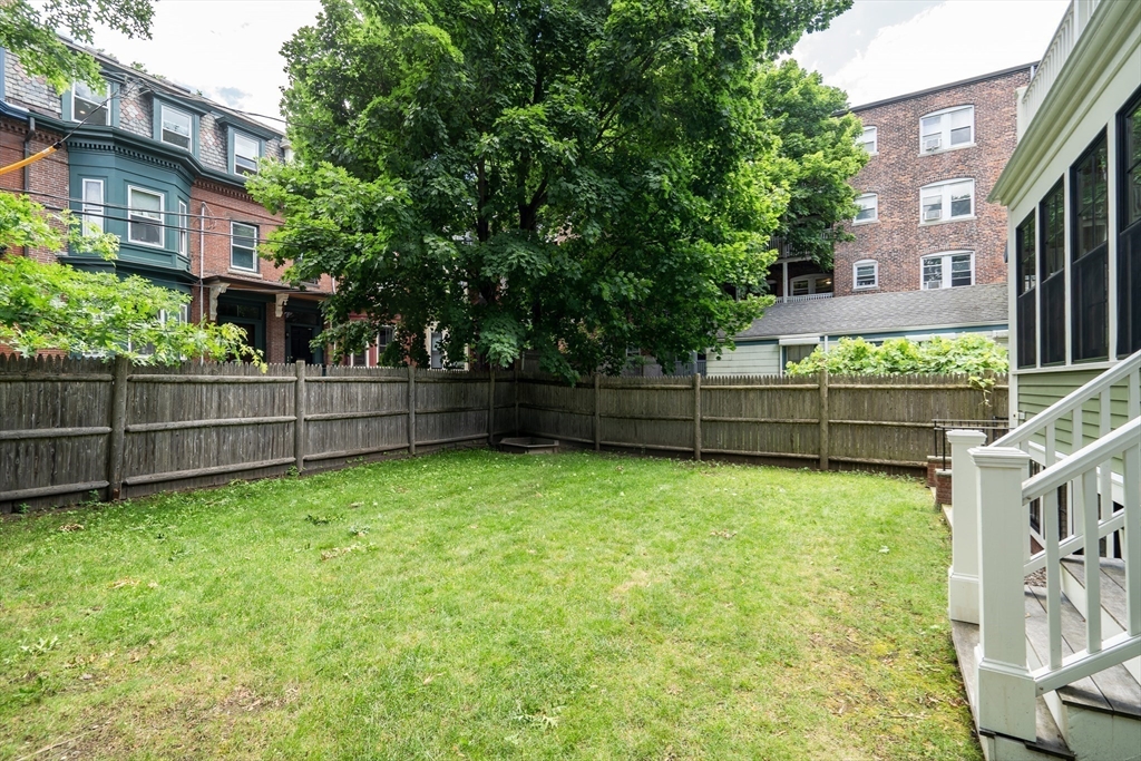 2 Percy Place Cambridge, MA 02139 - Photo 34 of 37 a view of backyard with green space and wooden fence
