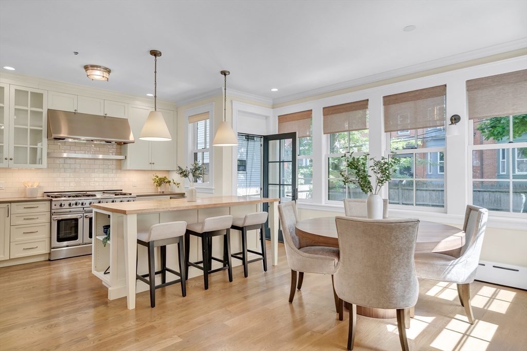 2 Percy Place Cambridge, MA 02139 - Photo 8 of 37 a large kitchen with a table and chairs