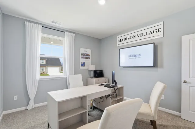 a view of a dining room with furniture and window