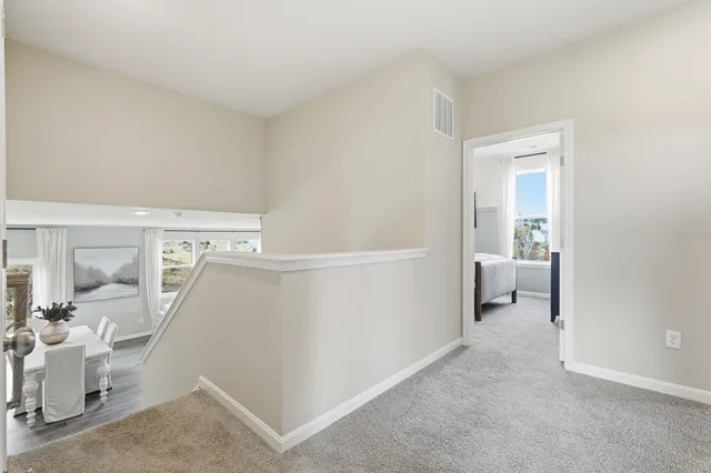 a view of a bedroom with a sink and a living room