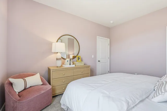 a bedroom with a bed and a couch