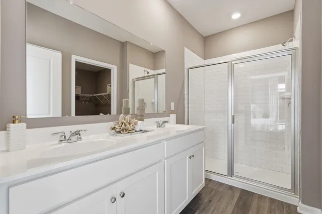a bathroom with a double vanity sink mirror and double