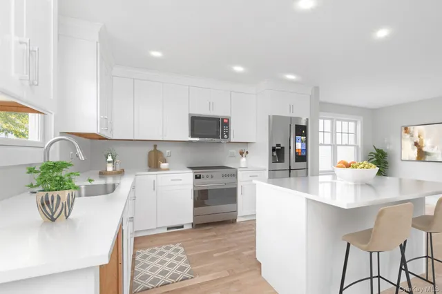 a kitchen with a table and chairs