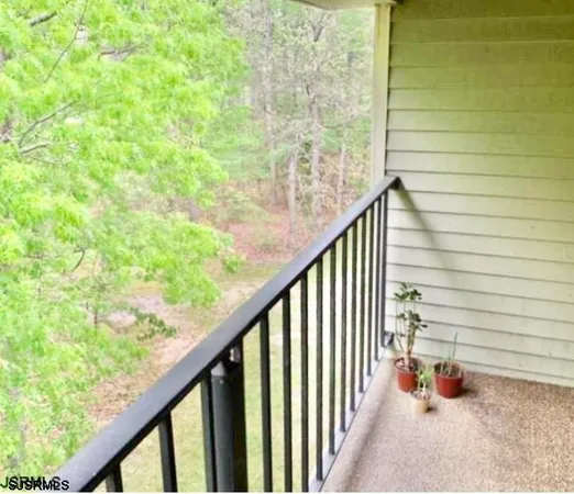 a view of balcony and trees