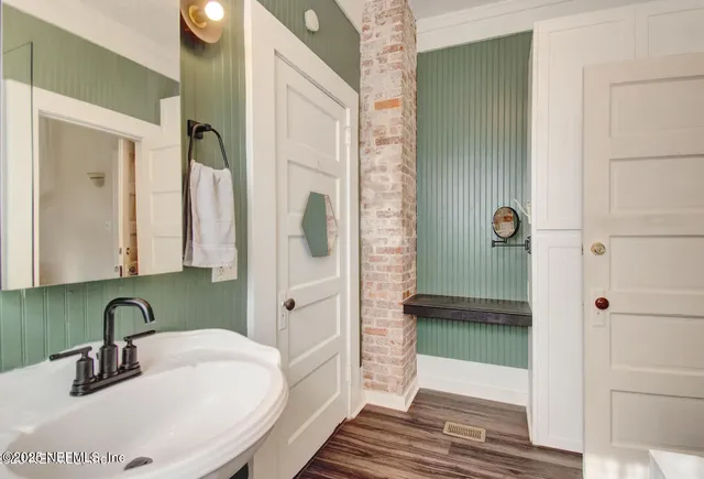 a bathroom with a sink and a mirror