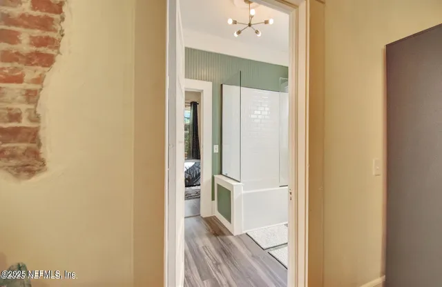 a view of a bathroom from a hallway