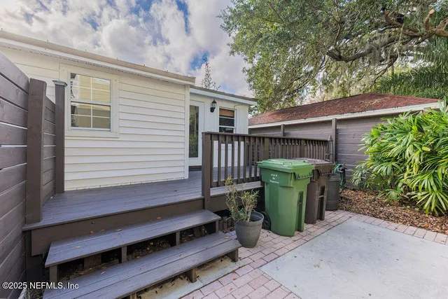 a view of a chairs setting in the backyard