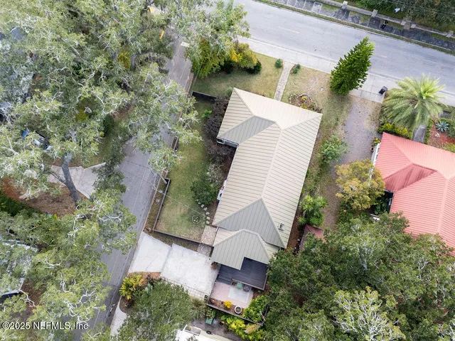 an aerial view of a house with outdoor space and street view