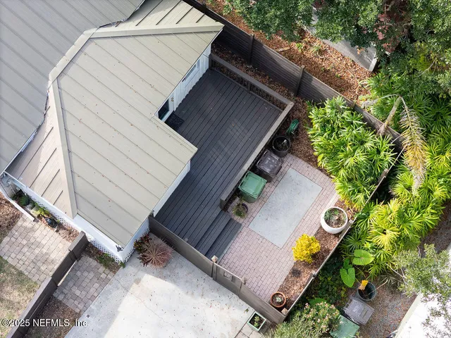 a view of a backyard with sitting area