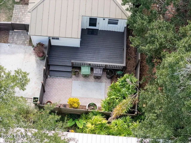 a aerial view of a house with swimming pool and garden