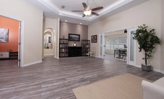 a view of a dining room with furniture and wooden floor