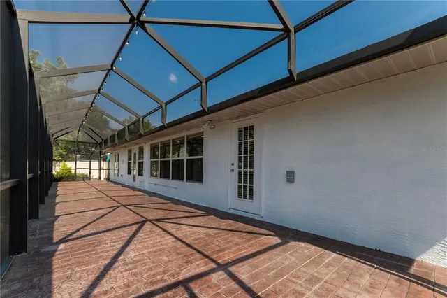 an aerial view of a house with swimming pool