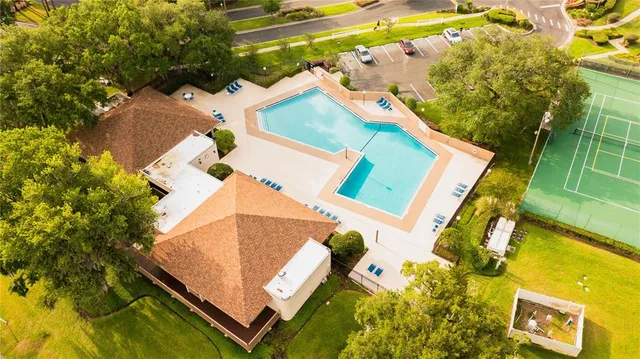 a view of a city with lush green forest
