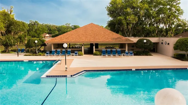 an aerial view of residential house with green space