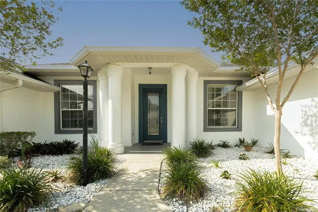 a kitchen with a sink a stove and a refrigerator