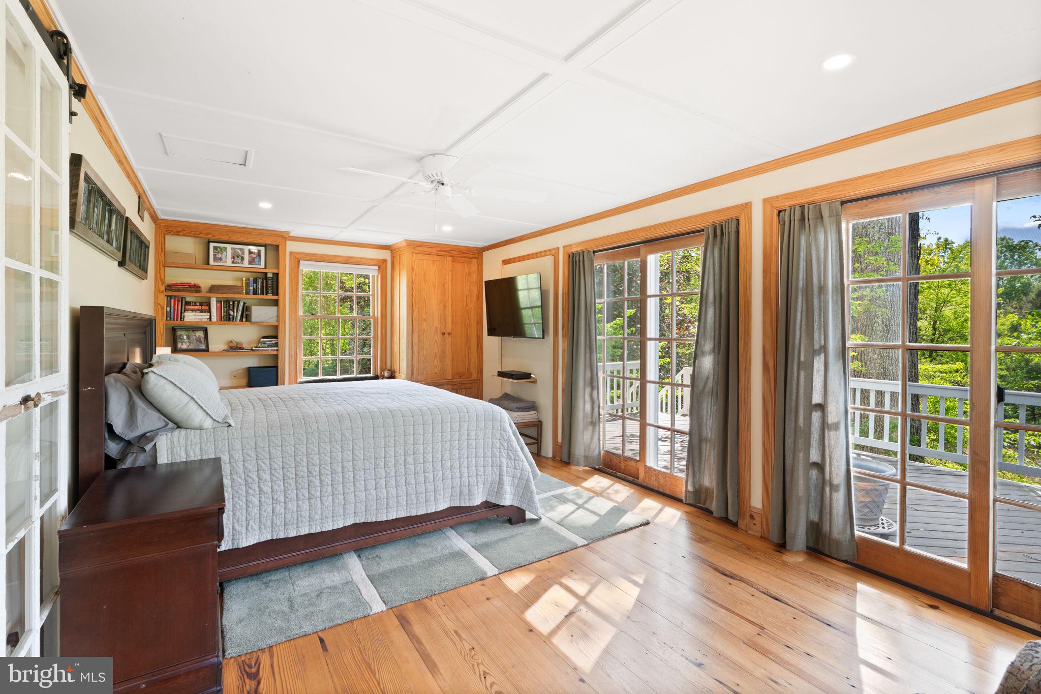 324 North Blue Ridge Turnpike Madison, VA 22727 - Photo 22 of 75 a bed sitting in a spacious bedroom next to a large window