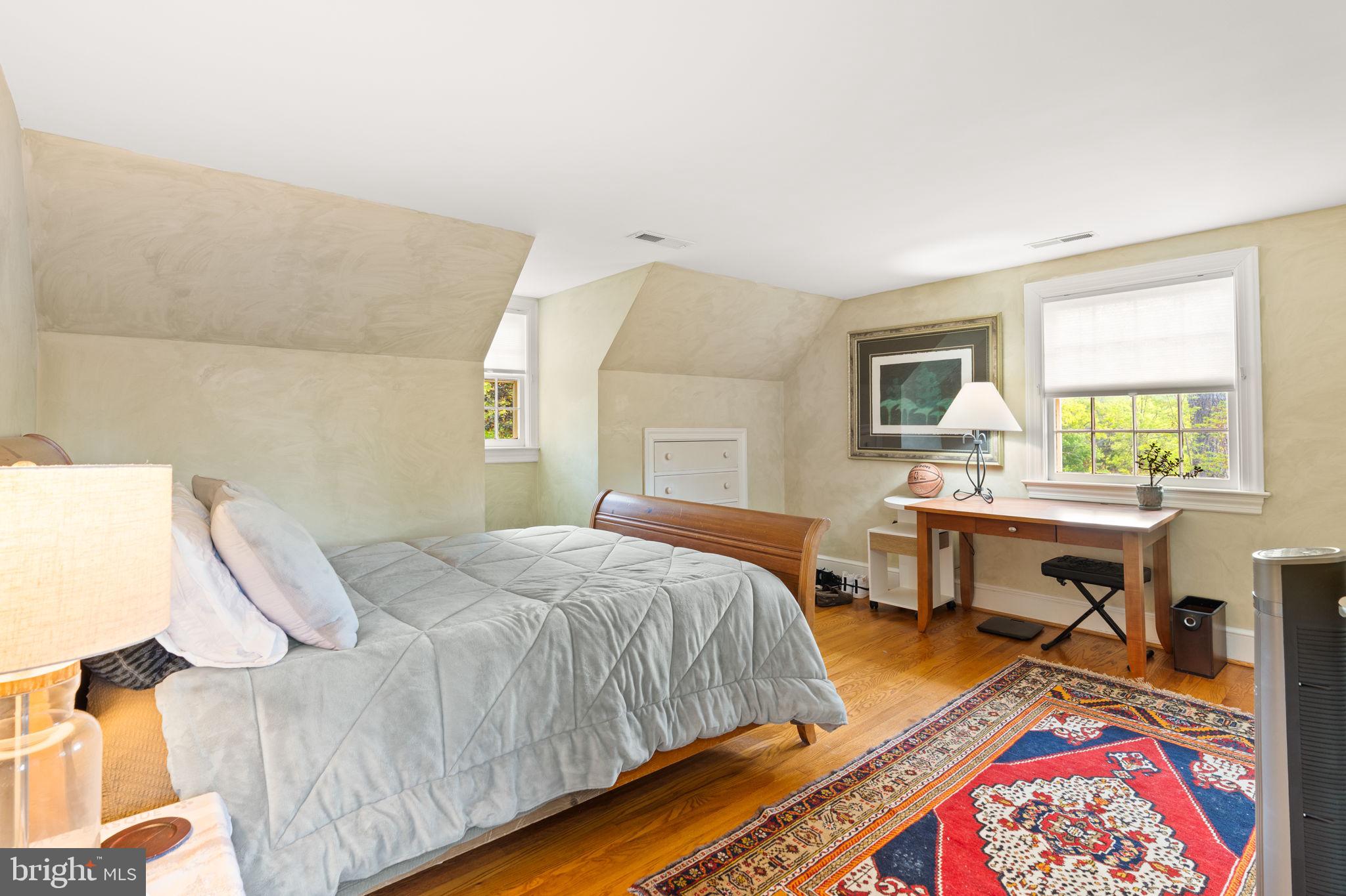324 North Blue Ridge Turnpike Madison, VA 22727 - Photo 27 of 75 a bedroom with a bed and a table in it