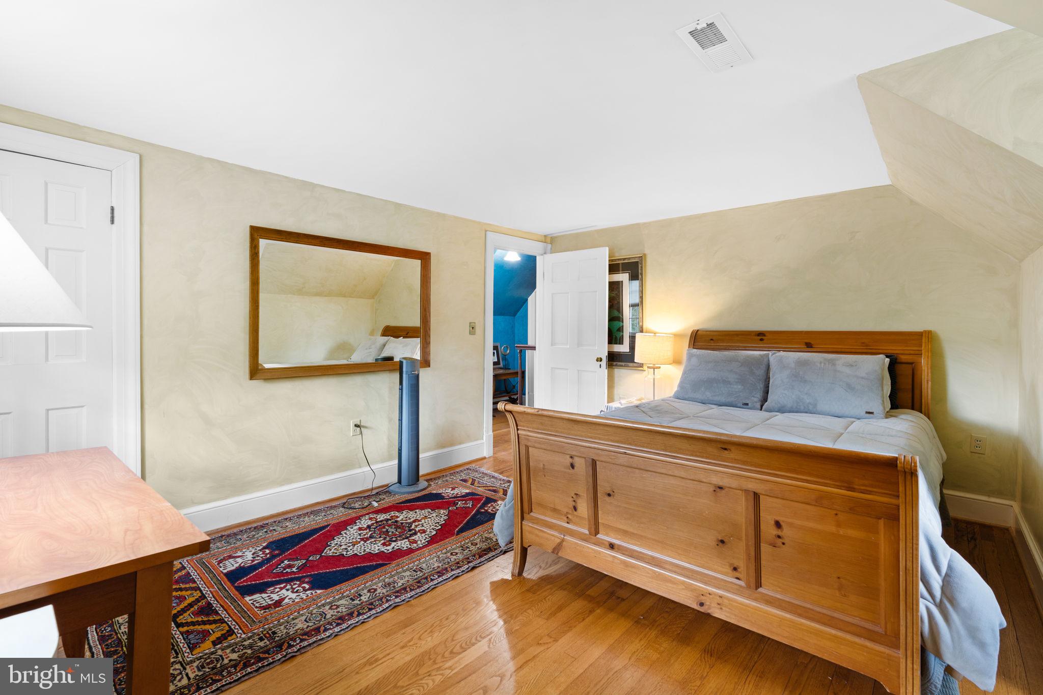 324 North Blue Ridge Turnpike Madison, VA 22727 - Photo 28 of 75 a bedroom with a bed and a dresser