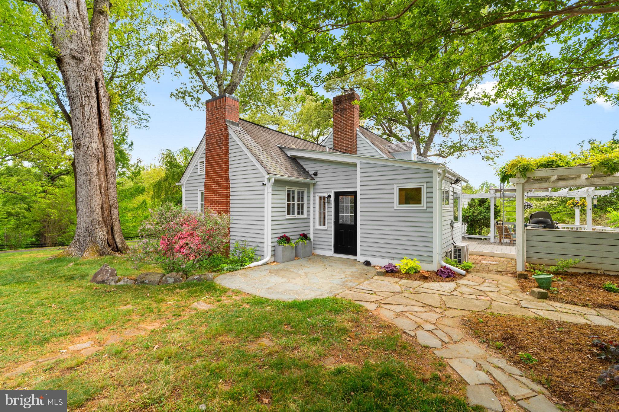 324 North Blue Ridge Turnpike Madison, VA 22727 - Photo 39 of 75 a view of a house with backyard and a tree