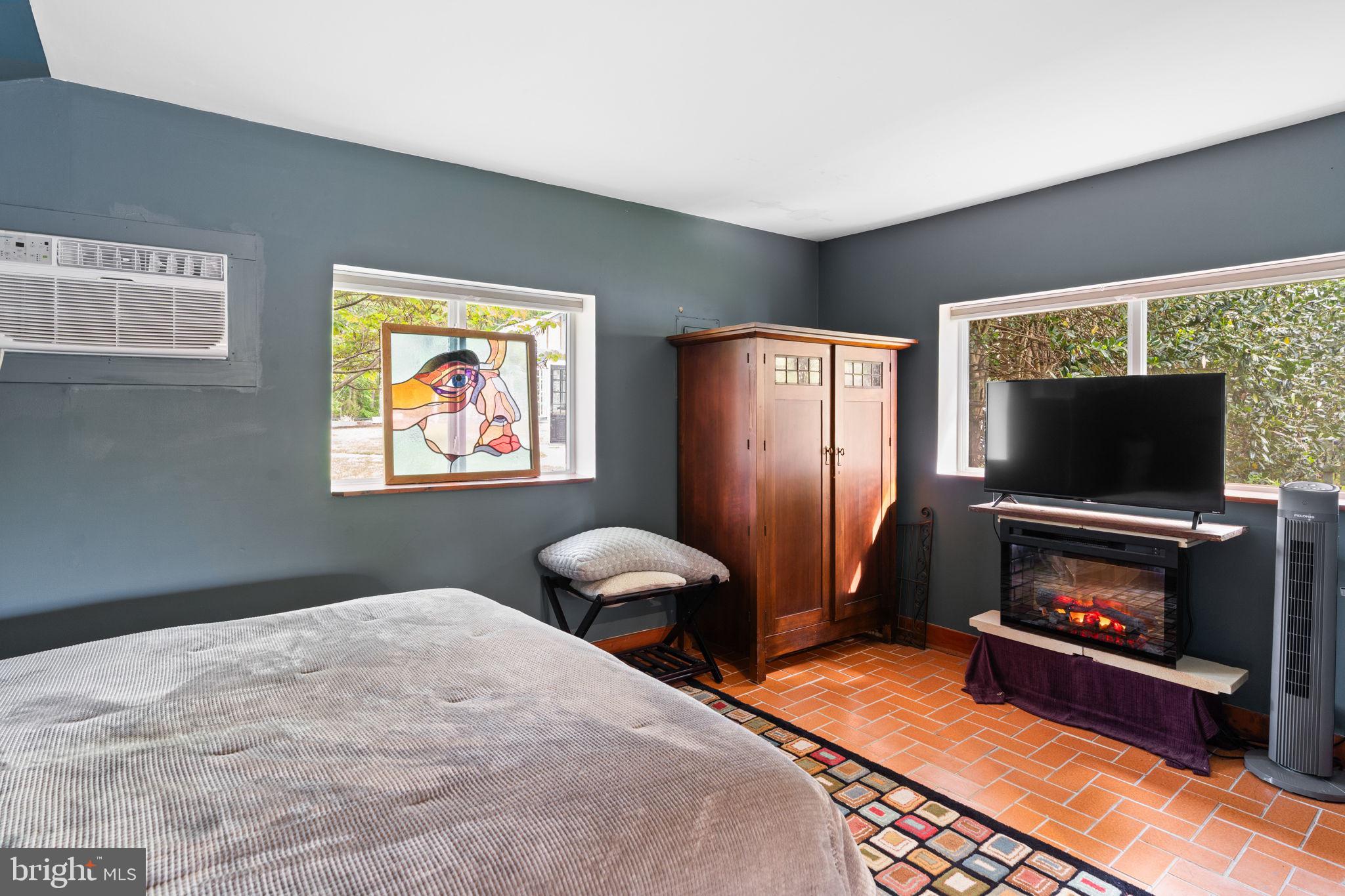 324 North Blue Ridge Turnpike Madison, VA 22727 - Photo 50 of 75 a bedroom with furniture and a flat screen tv